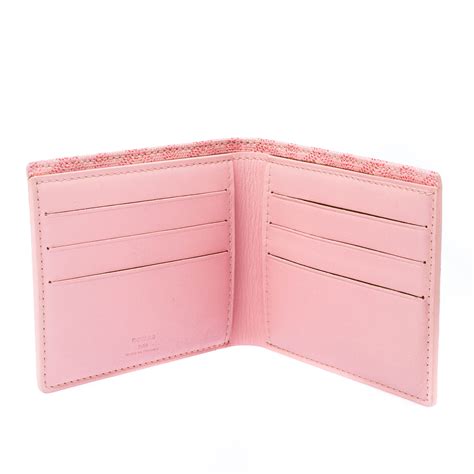 pink coated canvas bifold wallet.